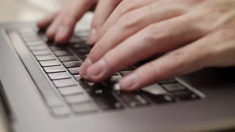 Close up macro of hands typing on laptop keyboard computer Stock Footage 274296549