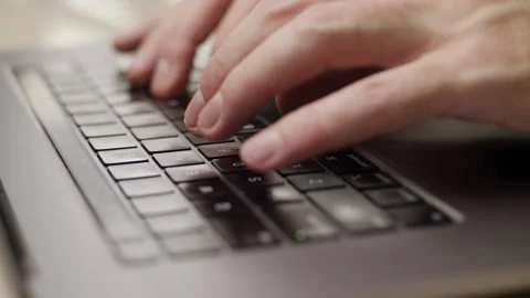Close up macro of hands typing on laptop keyboard computer Stock Footage 274296729