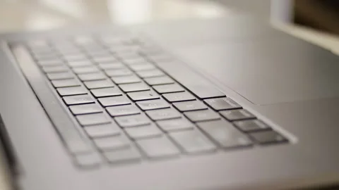 Close up macro of hands typing on laptop keyboard computer Stock Footage 274296796