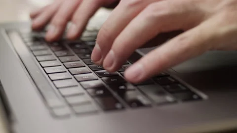 Close up macro of hands typing on laptop keyboard computer Stock Footage 274298138