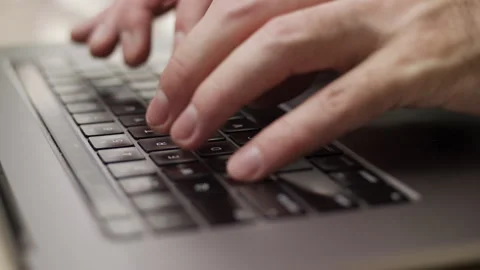 Close up macro of hands typing on laptop keyboard computer Stock Footage 274298192