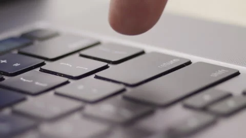 Close up macro of hands typing on laptop keyboard computer Video stock 274298337