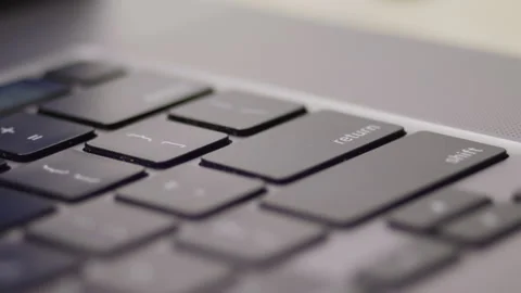 Close up macro of hands typing on laptop keyboard computer Stock-Footage 274298347