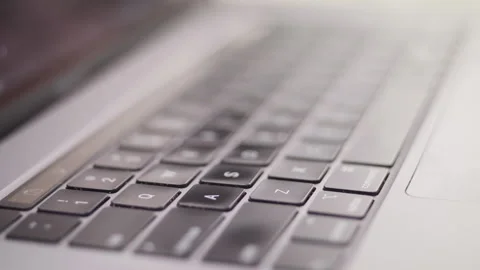 Close up macro of hands typing on laptop keyboard computer Stock Footage 274298637