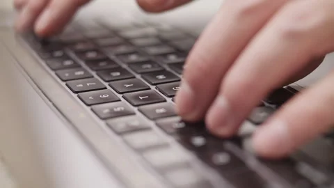 Close up macro of hands typing on laptop keyboard computer Stock Footage 274298897
