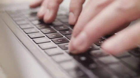 Close up macro of hands typing on laptop keyboard computer Vidéo 274299476