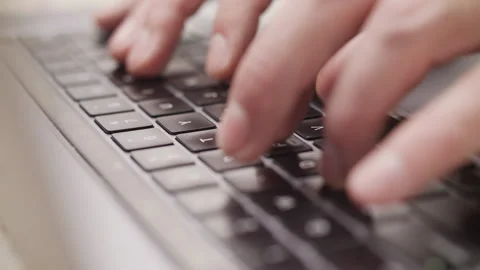 Close up macro of hands typing on laptop keyboard computer Vidéo 274299663