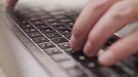 Close up macro of hands typing on laptop keyboard computer Stock Footage 274299875