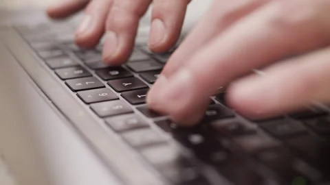 Close up macro of hands typing on laptop keyboard computer Stock Footage 274300196