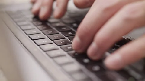 Close up macro of hands typing on laptop keyboard computer Vidéo 274300226