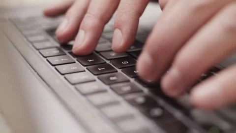 Close up macro of hands typing on laptop keyboard computer Stock Footage 274300233