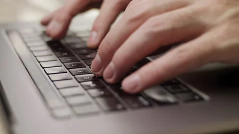 Close up macro of hands typing on laptop keyboard computer Stock Footage 274300521