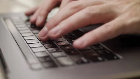 Close up macro of hands typing on laptop keyboard computer Stock Footage 274300654