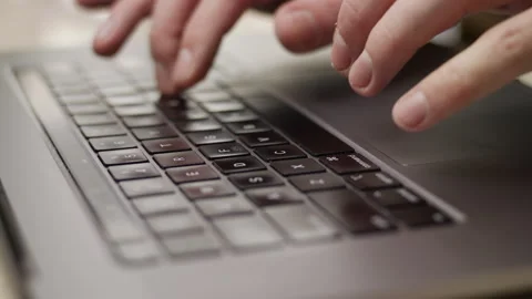 Close up macro of hands typing on laptop keyboard computer Stock Footage 274300663
