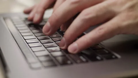Close up macro of hands typing on laptop keyboard computer Stock Footage 274300664