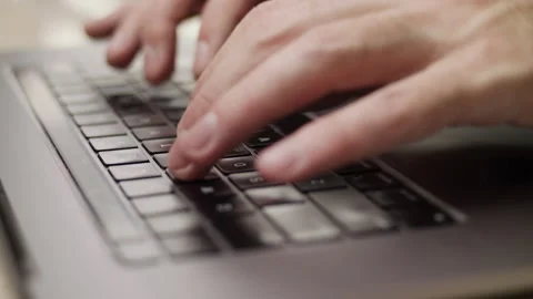 Close up macro of hands typing on laptop keyboard computer Stock Footage 274301017