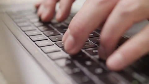 Close up macro of hands typing on laptop keyboard computer Stock Footage 274301087