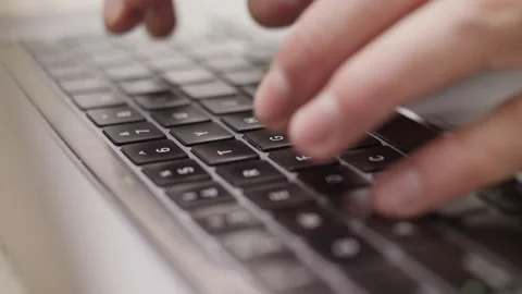 Close up macro of hands typing on laptop keyboard computer Stock Footage 274301089