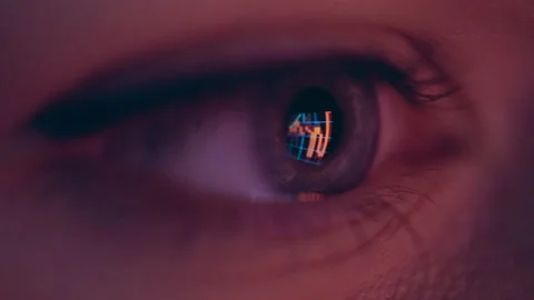 Close-up of a macro human eye showing business graphics. Stock Footage 236483348