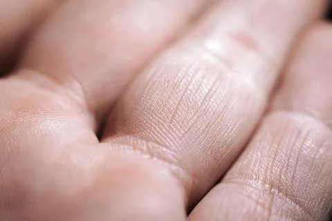 A close-up macro image of human skin, showing fine textures, intricate lines. Фото