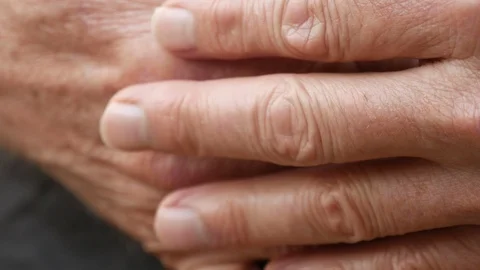 Close up macro of man's 3 fingers of one hand tapping on top of the other 動画素材 128649922