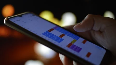 Close-up macro man's hand with google calendar on his phone Stock-Footage 197814404