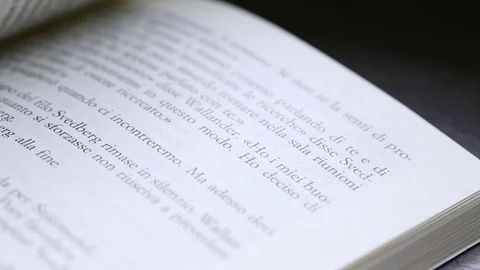 Close up macro of man's hand turning pages of a book Stock Footage 128138490