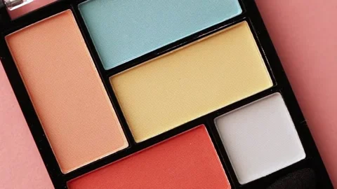 Close-up Macro Pan Over Color Corrector Palette and Pink Lipstick with Blush Stock Footage 346300814