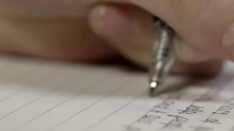 Close Up Macro of a pen writing essay in an exam or classroom, shallow depth Vídeos de archivo 67485831