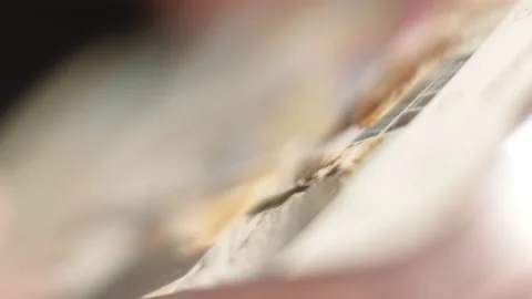 Close-up Macro: Person or Human Holding and Using Smartphone, Browsing through Stock Footage 194800679