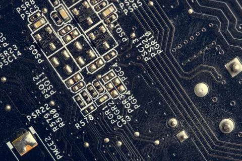 A close up macro photo of a generic technology motherboard circuit board (pcb Stock Photos