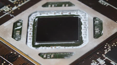 Close up macro of putting thermal pasta on GPU chip. Video stock 136983266