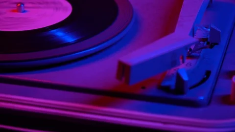 Close up macro of a record being played on a retro turntable that plays vinyl Stock Footage 121312707