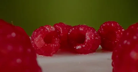 Close-Up Macro of a red raspberries fruit. Fresh, juicy raspberry, background 動画素材 243904954