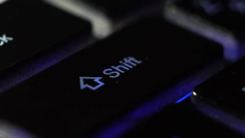 Close-up macro shooting the blinking led light blue buttons on the keypad shift Stock Footage 130204945