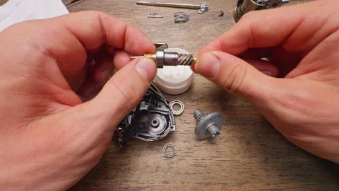 Close Up Macro Shot of Applying Grease on Worm Shaft Threads With Wooden Stick D Video stock 334951133