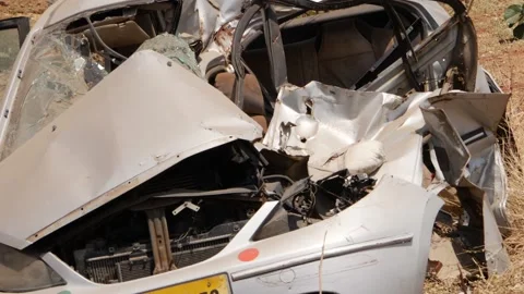 Close macro shot of crushed car along the road Stock Footage 151835530