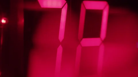 Close up macro shot of Digital Clock numbers rising up and flashing red light Stock Footage 208805946