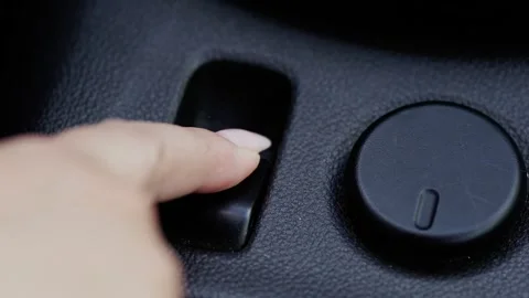 Close Up Macro Shot Disengaging Electric Handbrake in Modern Car 4K Stock Footage 337323288