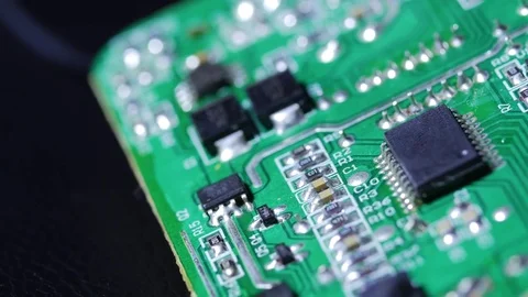 Close up macro shot of electronic chip circuit board rotating around Stock Footage 70239598