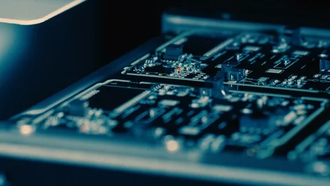 Close-up Macro Shot of Electronic Factory Machine at Work: Printed Circuit Board Stock Footage 98185995
