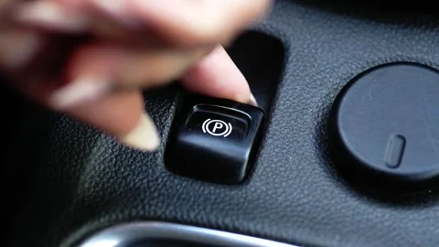 Close Up Macro Shot Engaging Electric Handbrake in Modern Car 4K Stock Footage 337323290