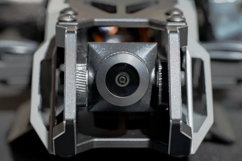Close-up macro shot of FPV drone's camera lens and gimbal mount with intric.. Stock Photos