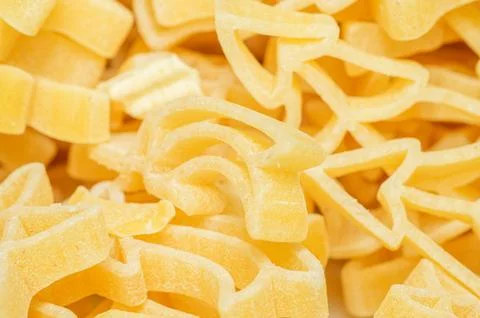 Close-up macro shot of fun shaped pasta, perfect for kids' meals Stock-Fotos