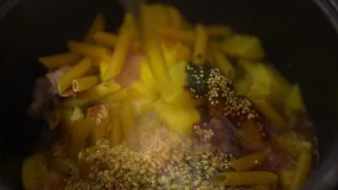 Close-up macro shot inside a black cooking pot where Stock Footage 329116697