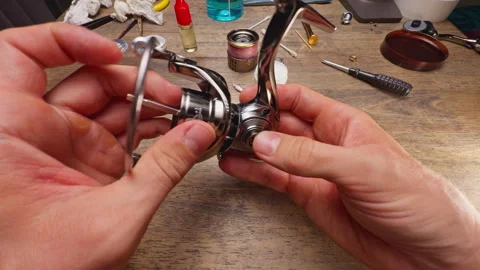 Close Up Macro Shot of Installing Rotor Assembly on Spinning Fishing Reel Body D Stock Footage 334953832