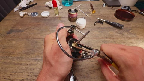 Close Up Macro Shot of Installing Rotor Nut Lock Clip on Spinning Fishing Reel D Stock Footage 334953894
