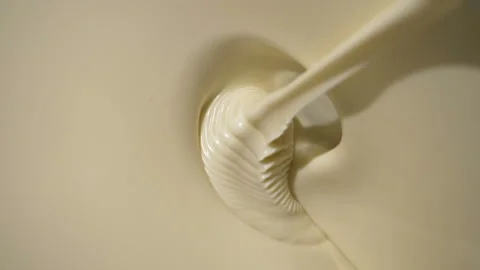 Close-up macro shot melted liquid white chocolate sauce . Stock Footage 170311235