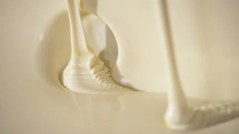 Close-up macro shot melted liquid white chocolate sauce . Stock Footage 170311416