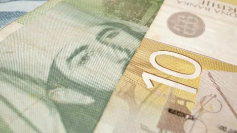 Close-up macro shot of multiple Serbian dinar banknotes in motion. 스톡 동영상 301782143